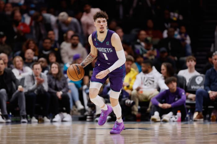 Charlotte Hornets guard LaMelo Ball dribbles the ball up the court.